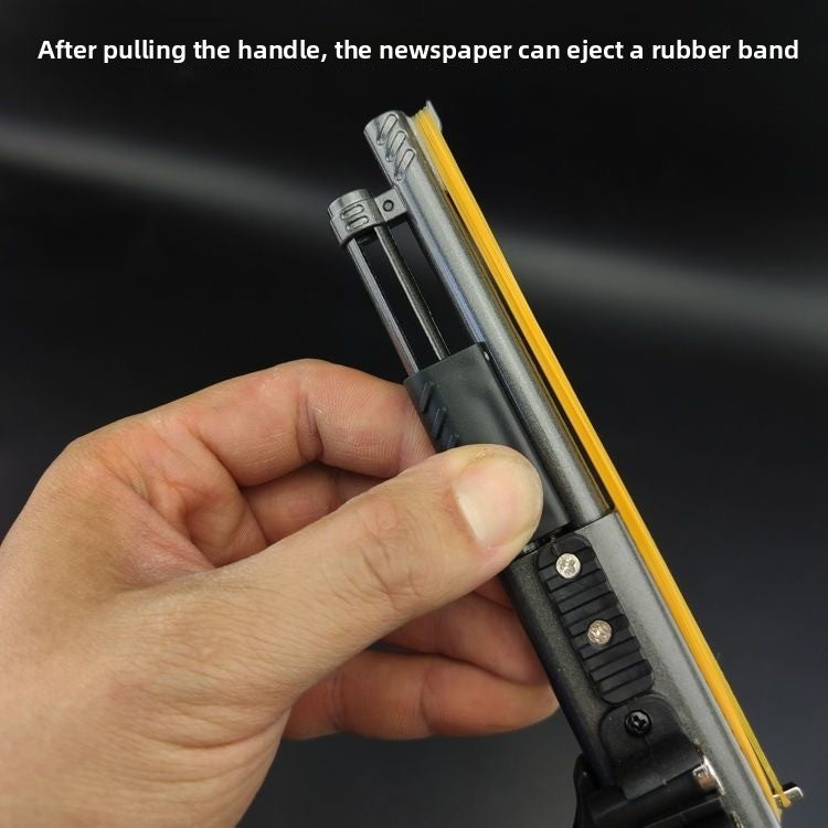 Pull the handle to eject the rubber band