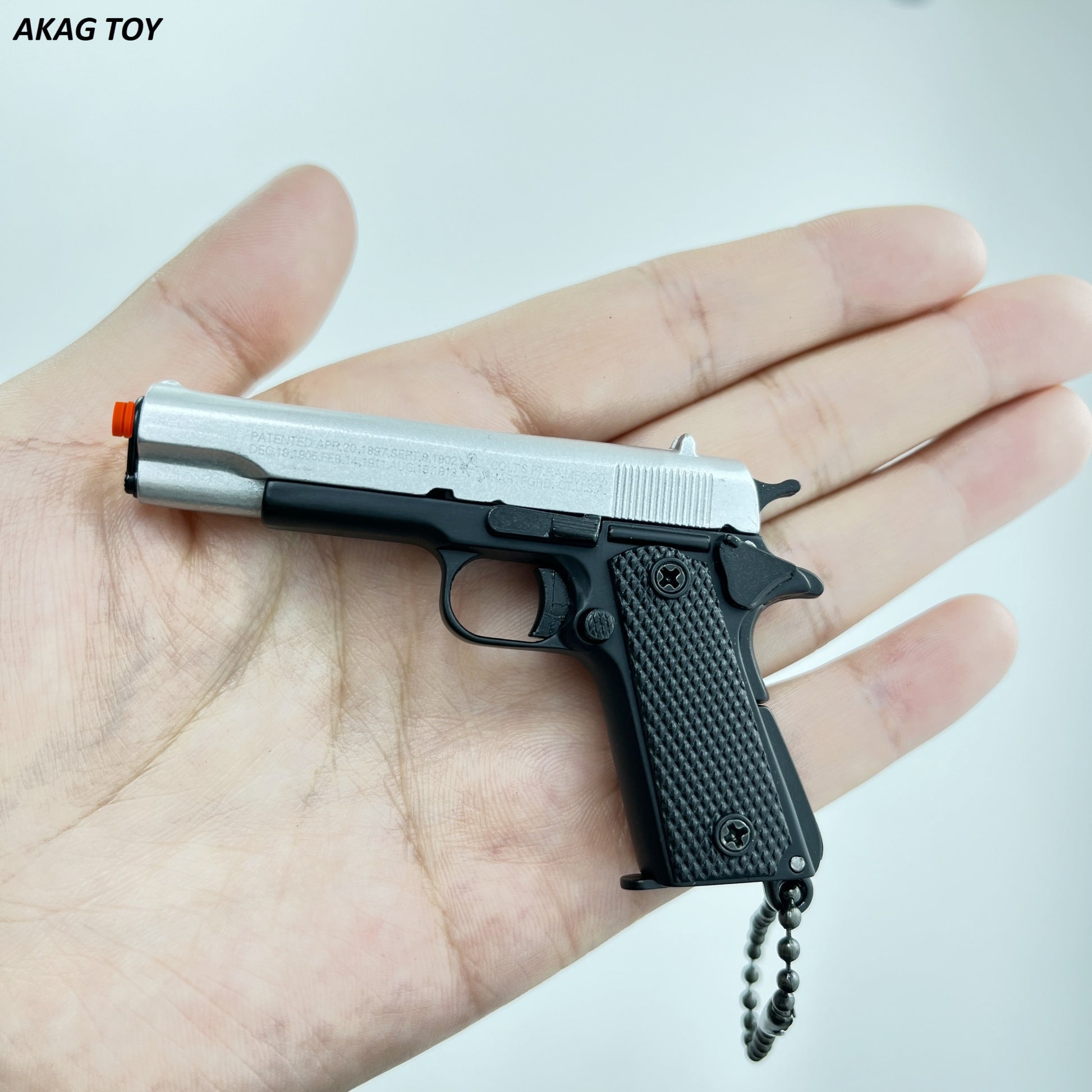 Silver and black mini 1911 pistol keychain