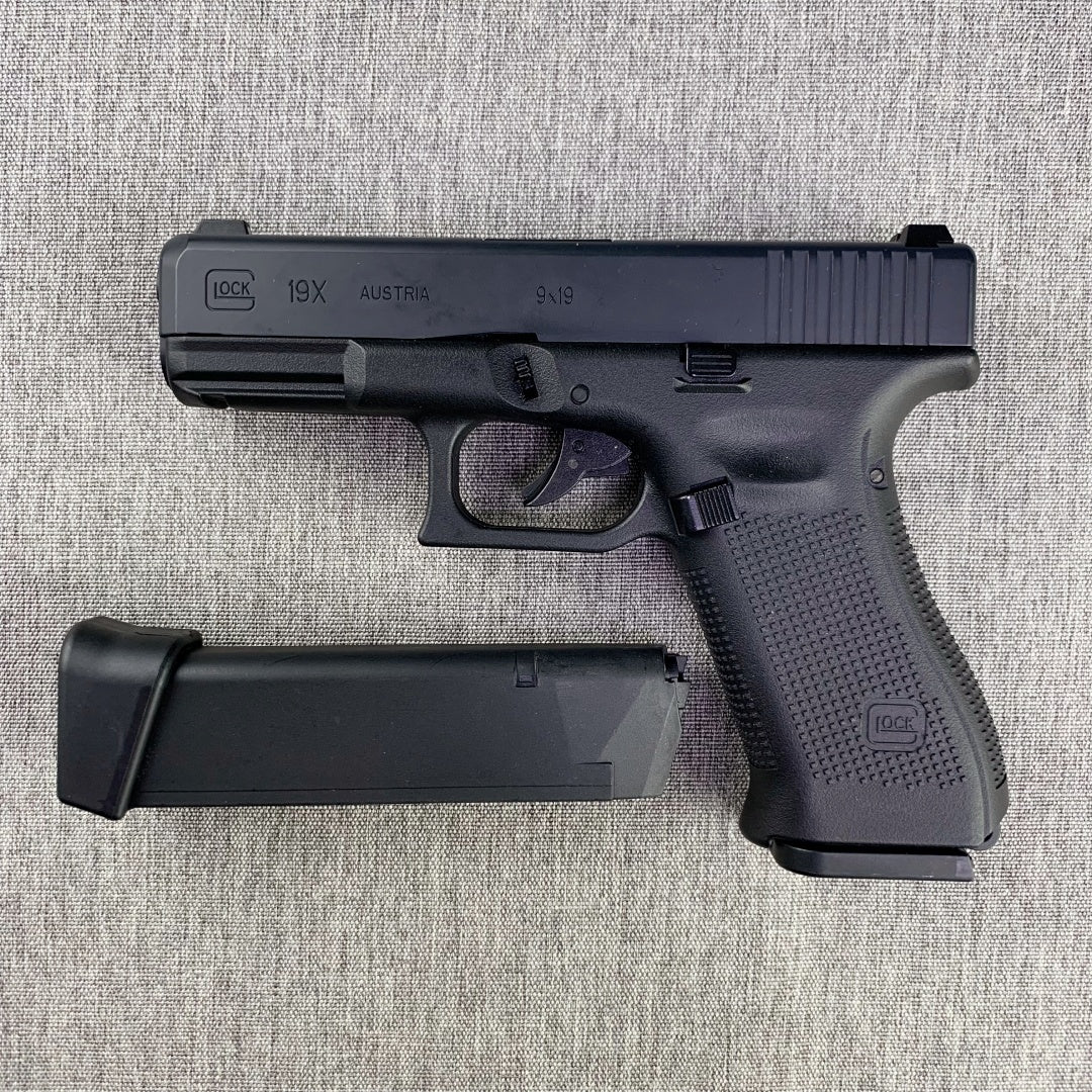 black-toy-gun-with-two-magazines